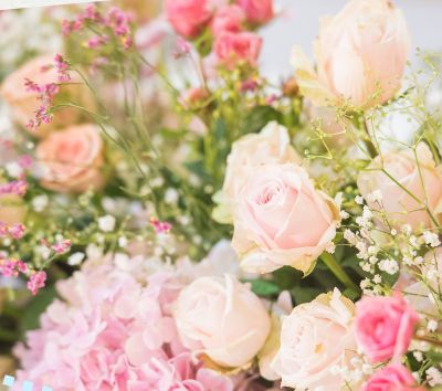 A bouquet of pink and cream roses